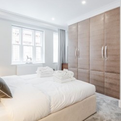 double bedroom, towels and bathrobes, large wardrobe, The Mews Apartments, Mayfair, London
