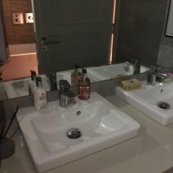 bathroom with two sinks and free toiletries, Westminster Deluxe Flats, Westminster, London