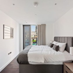 large bedroom with UK King size bed in Mint Serviced Apartments, Tower Hill, London
