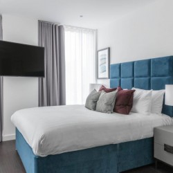 main bedroom with flat screen TV, Mint Serviced Apartments, Tower Hill, London