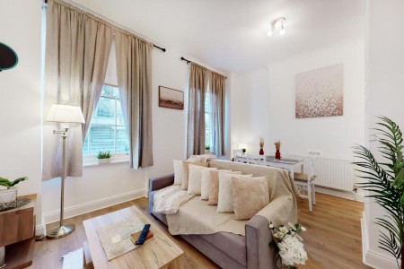 living room with table, sofa and dining area, Baker Street Apartments, Marylebone, London NW1