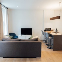 living room with sofa, tv, breakfast bar and kitchen, Wigmore Street Apartments, Marylebone, London W1