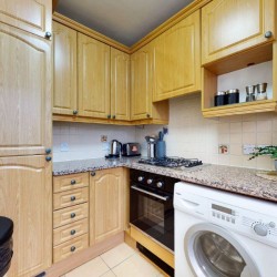 kitchen for self catering with washer dryer and plant, Clarges Apartments, Mayfair, London W1
