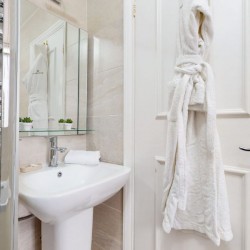 bathroom with bathrobe and sink, Chesterfield Apartments, Mayfair, London W1
