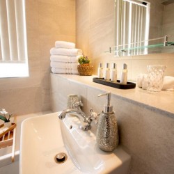 bathroom with towels and toiletries, Chesterfield Apartments, Mayfair, London W1