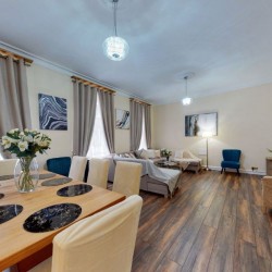 spacious living room with dining area, sofa, chairs and tv, Chesterfield Apartments, Mayfair, London W1