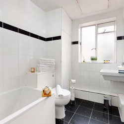 bathroom with tub, towels and sink, Chesterfield Apartments, Mayfair, London W1