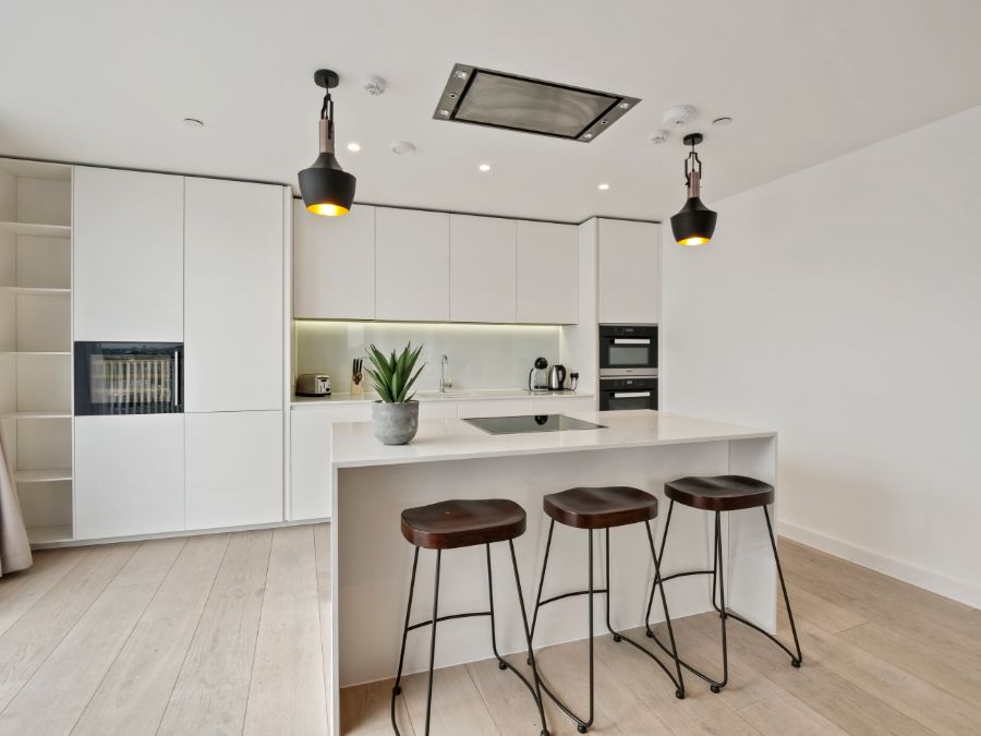 modern kitchen with breakfast bar, stools and roof lamps, The Residences, Southwark, London SE1