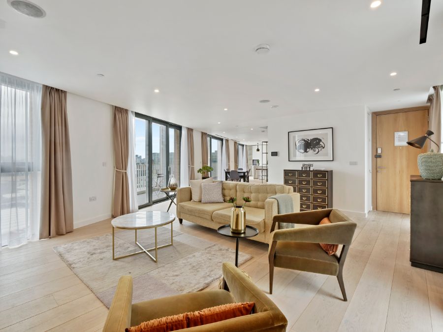 large living room with chairs, sofa, drawers, and view to balcony, The Residences, Southwark, London SE1