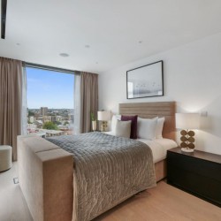 bedroom with large bed, side tables and view to London Bridge area, 3 bedroom penthouse apartment
