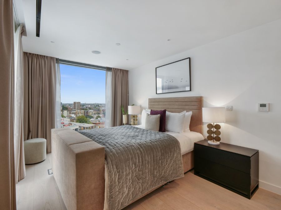 bedroom with large bed, side tables and view to London Bridge area, 3 bedroom penthouse apartment