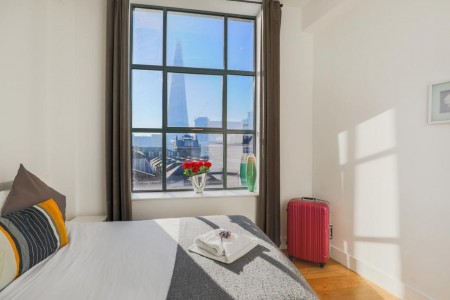 bedroom with view of the shard building, Lower Thames Apartments, City, London EC3