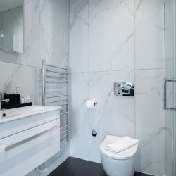 sink and heating towel rail, studio, Kensington Apartments, Kensington, London SW7