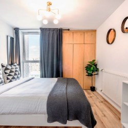 double bedroom with fitted wardrobe, Drury Lane Apartment, Covent Garden, London WC2