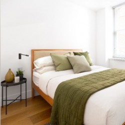 double bed with bedding and side table, Mar Apartments, Marylebone, London W1