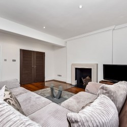 large sofa, fireplace and tv, Portman Square Apartment, Marylebone, London W1