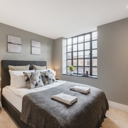 double bedroom with towels, The Strand Apartment, Covent Garden, London WC2