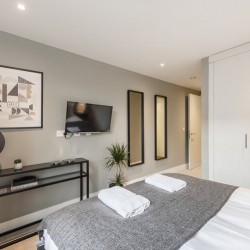 bedroom with fitted wardrobes, The Strand Apartment, Covent Garden, London WC2