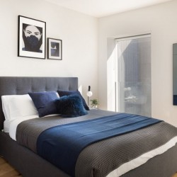 double bed with side table and large mirror, Natver Short let Apartments, Southwark, London SE1