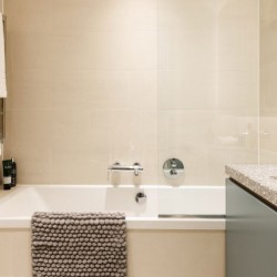 bathroom with bathtub, shower and towel rail, ,Natver Short let Apartments, Southwark, London SE1