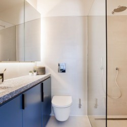 bathroom with rainfall shower, cabinets and large mirror, Natver Short let Apartments, Southwark, London SE1