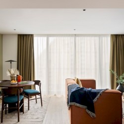 living area with sofa and dining table in large studio, Canary Wharf Apart Hotel, Canary Wharf, London E14