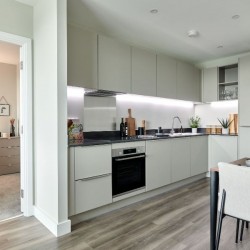 equipped kitchen with dining table and view to bedroom, Kew Apartments, Kew, London TW8