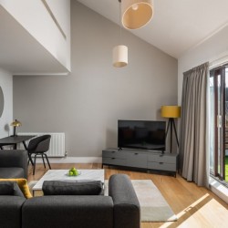 living room with sofa, work desk, tv and view to balcony, Kensington High Street, Kensington, London W8