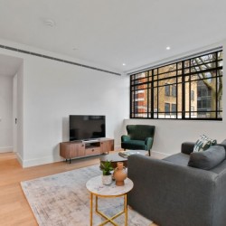 living room with sofa, 2 tables, chair and smart tv, Fitzrovia Serviced Apartments, Fitzrovia, London W1