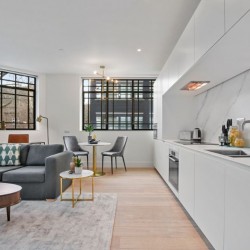 1 bedroom apartment with sofa, table, dining area and kitchen, Fitzrovia Serviced Apartments, Fitzrovia, London W1