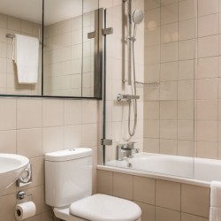 bathroom with sink, toilet, bathtub and mirror, Kensington High Street, Kensington, London W8