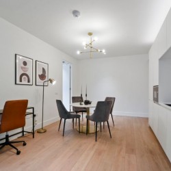 large area with work desk, dining table and kitchen, Fitzrovia Serviced Apartments, Fitzrovia, London W1