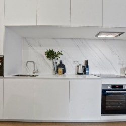 white kichen with microwave, cooker, toaster and kettle, Fitzrovia Serviced Apartments, Fitzrovia, London W1