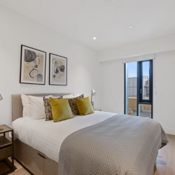 double bedroom with bed and side table, Fitzrovia Serviced Apartments, Fitzrovia, London W1