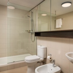 bathroom with shower cubicle, WC, bidet, sink and mirrors, Kensington High Street, Kensington, London W8