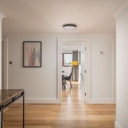 hall with side tabe, vase, mirror and view to living room, Kensington High Street, Kensington, London W8