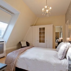 bedroom with double bed, work desk and fitted wardrobes, Barrett Apartment, Marylebone, London W1