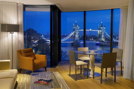 living room with sofa, dining table and view to Tower Bridge
