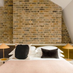 double bedroom with brick wall, 3-Bedroom Penthouse, Marylebone, London W1