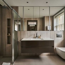 bathroom with large sink. mirrors, toilet and shower, Portland Apartments, Marylebone, London W1