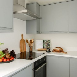 kitchen, bowl of tomatoes, tools, cook book and bread, The Deluxe Apartments, Marylebone, London W1