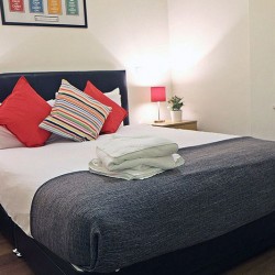 double bed with pillows and towels, Liverpool Street Apartments, City, London EC2