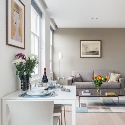 dressed dining table, sofa and table with flowers, Hampstead Apartments, Hampstead, London NW3