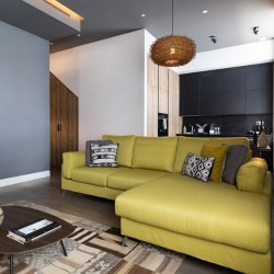 large yellow sofa, coffee table and kitchen, Mornington Crescent, Camden, London NW1