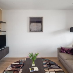 living room with sofa, rug, coffee table, tv and standing lamp, Camden Town Apartments, Camden, London NW1