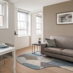 living room with sofa, small table and dining table, Hampstead Apartments, Hampstead, London NW3