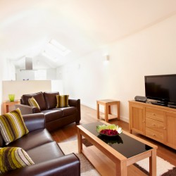 living area with leather sofas, table, console with tv, Liverpool Street Apartments, City, London EC2