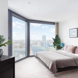 bedroom with large bed and city view, City Road Apartments, Hoxton, London EC1
