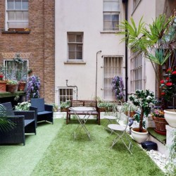garden with plants and furniture, Piccadilly Circus, Soho, London SW1