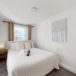 double bed and side table, Baker Street Apartments, Marylebone, London NW1